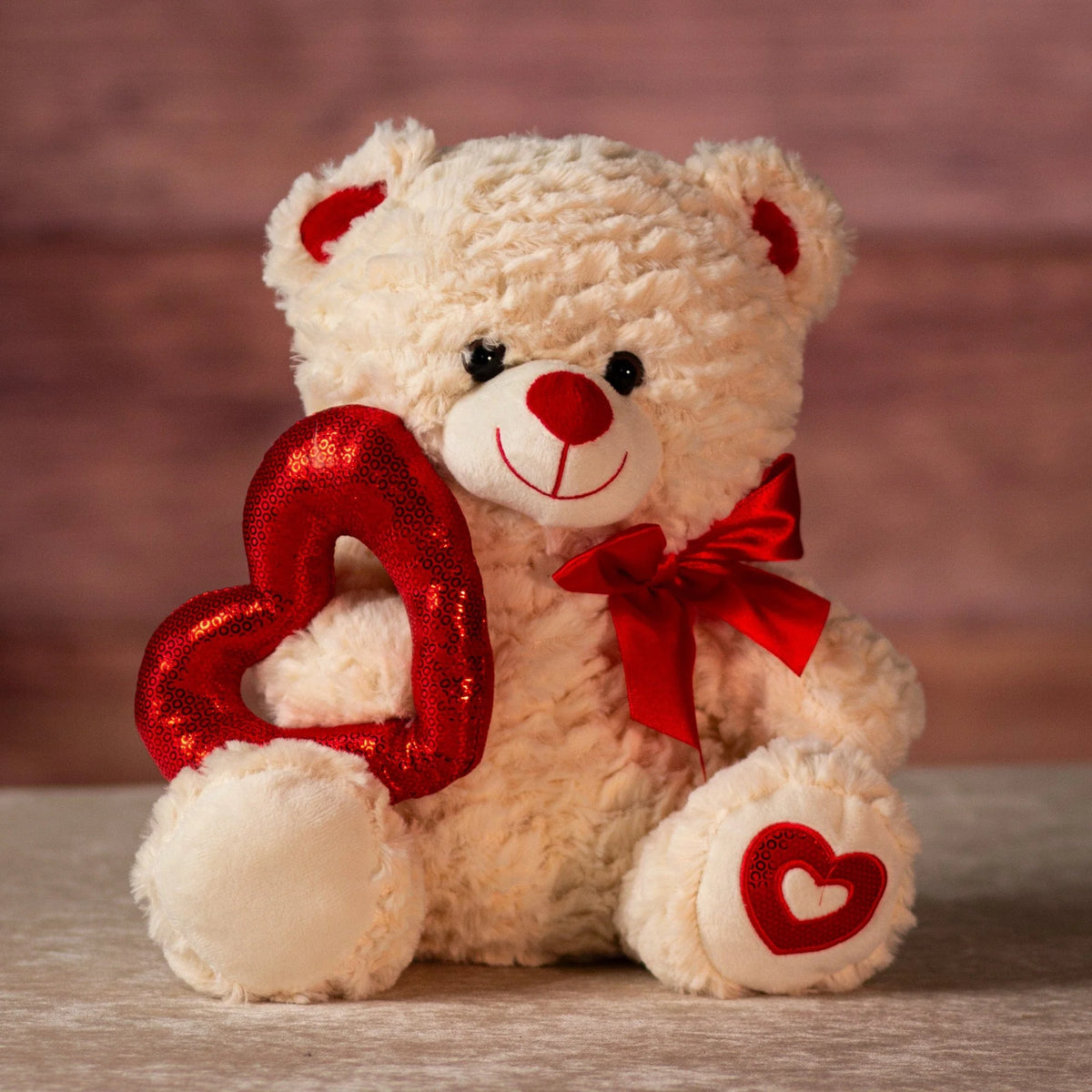 Hold My Heart teddy bear holding shiny outline heart, Valentine's gift from Clifton Park florist
