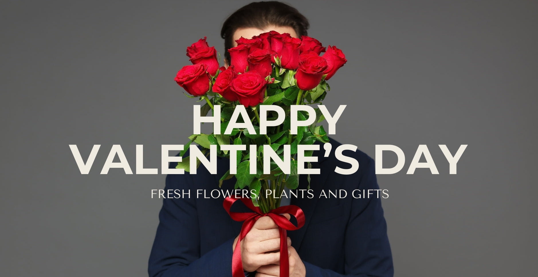 Person holding red roses with 'Happy Valentine's Day' text on a gray background